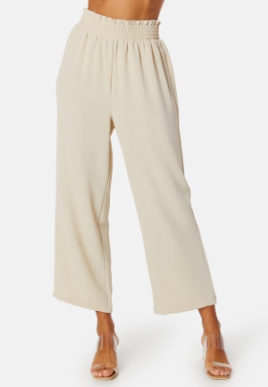 Se BUBBLEROOM Matilde Trousers Light beige 2XL ved Bubbleroom