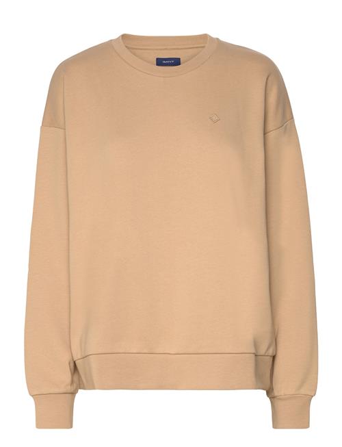 Se GANT G Badge C-Neck GANT Beige ved Booztlet