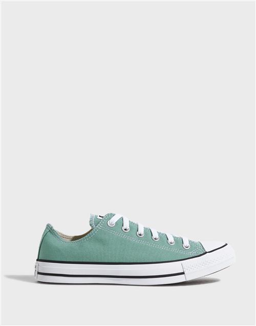 Se Converse Chuck Taylor All Star Lave sneakers Grøn ved NLY Man