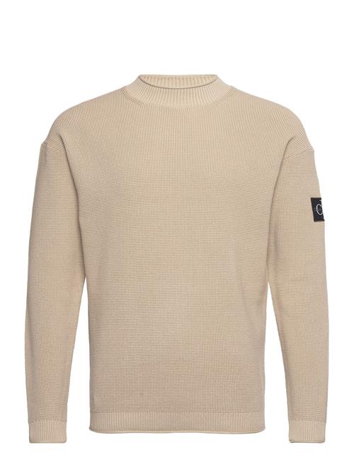 Se Calvin Klein Jeans Badge Relaxed Sweater Calvin Klein Jeans Beige ved Booztlet