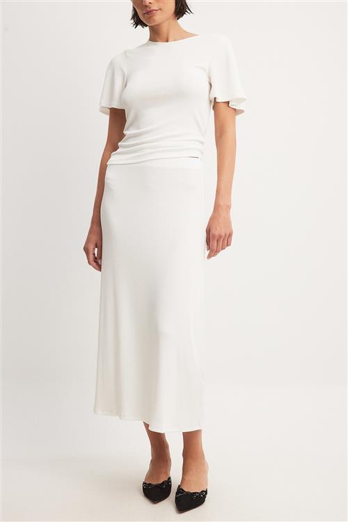 Se NA-KD Soft Rib Midi Skirt - White ved NA-KD