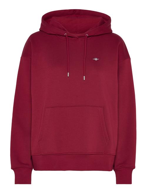 Se GANT Rel Shield Hoodie GANT Red ved Booztlet