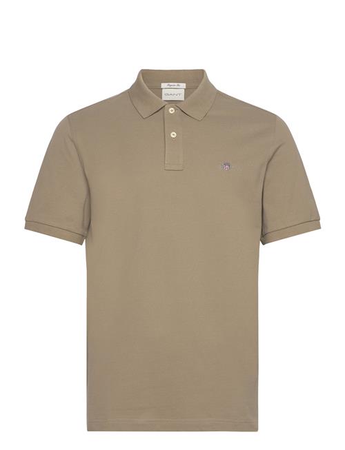 Se GANT Reg Shield Ss Pique Polo GANT Beige ved Booztlet