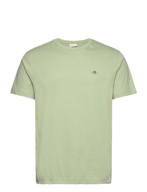 Se GANT Reg Shield Ss T-Shirt GANT Green ved Booztlet