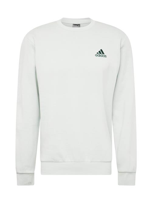 Se ADIDAS SPORTSWEAR Sportsweatshirt 'FEELCOZY'  grøn / pastelgrøn ved About You