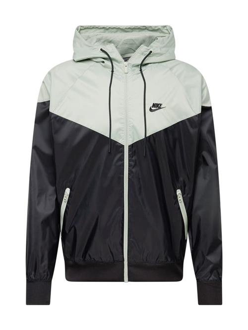 Nike Sportswear Overgangsjakke 'Heritage Essentials'  pastelgrøn / sort