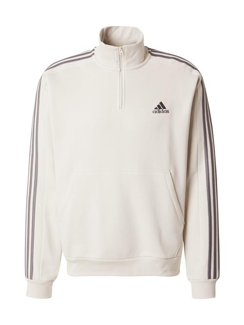 Se ADIDAS SPORTSWEAR Sportsweatshirt 'Essentials'  beige / grå ved About You