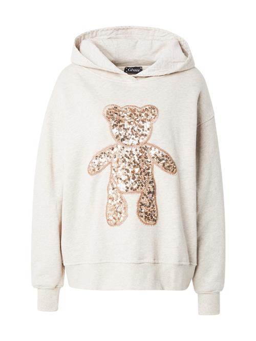 Se Grace Sweatshirt 'Goldbear'  sand / guld ved About You