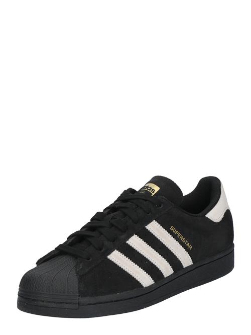 Se ADIDAS ORIGINALS Sneaker low 'Superstar'  guld / sort / hvid ved About You