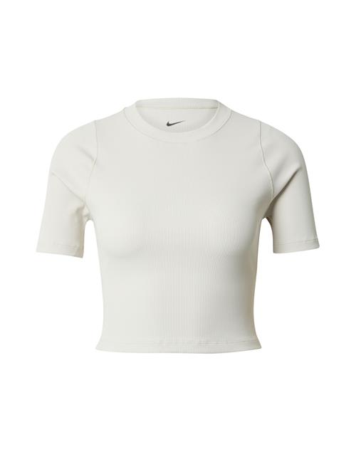 Se NIKE Funktionsbluse  cappuccino / sort ved About You