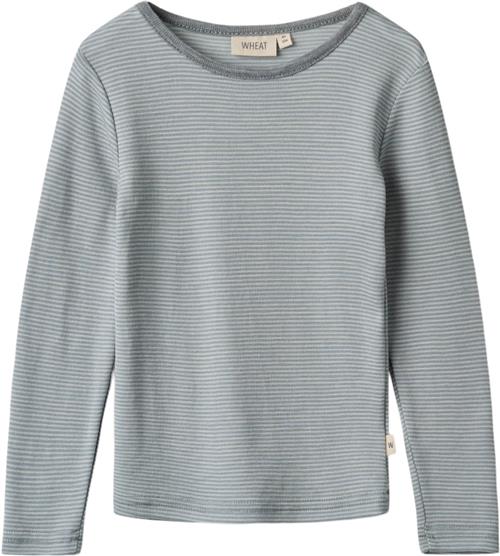 Se Wheat Langærmet Uld Tshirt Str 110 / 5 år Uld - Navy Stripe Langærmede T-shirts hos Magasin ved Magasin