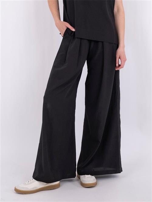 Se Neo Noir Lana Pants Kvinde Black Bukser Med Brede Ben Str 36 - hos Magasin ved Magasin