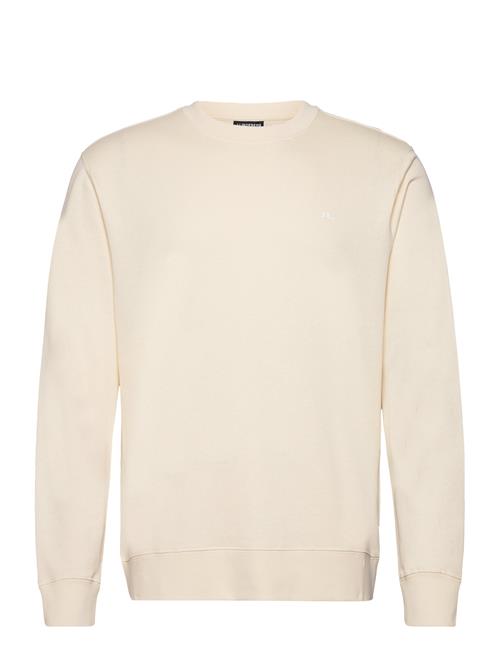 Se J. Lindeberg M Crew Neck Sweat J. Lindeberg Cream ved Booztlet