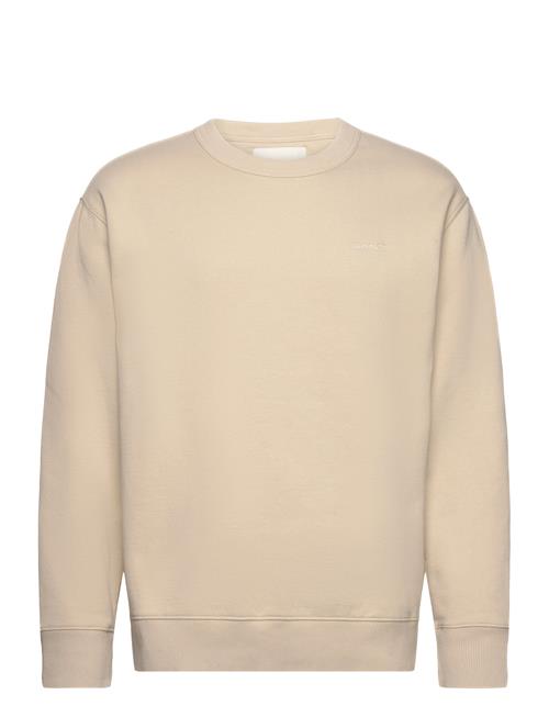 Se GANT Logo C-Neck Sweat GANT Beige ved Booztlet