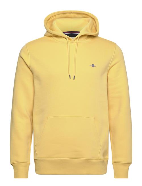 Se GANT Reg Shield Hoodie GANT Yellow ved Booztlet