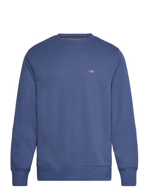 Se GANT Reg Shield C-Neck Sweat GANT Blue ved Booztlet