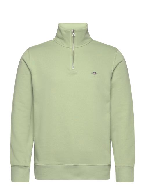 Se GANT Reg Shield Half Zip Sweat GANT Green ved Booztlet