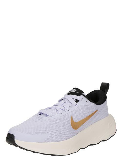 Se NIKE Løbesko 'Legend Essential'  guld / lilla ved About You