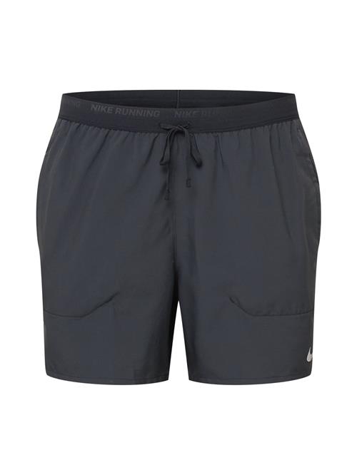 NIKE Sportsbukser 'Stride'  sort / hvid