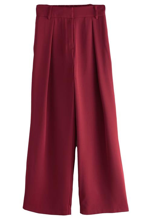 Next Bukser med lægfolder  rød