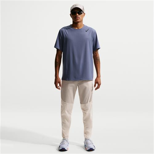 Vævede Nike Stride Plus Repel-løbebukser til mænd - brun