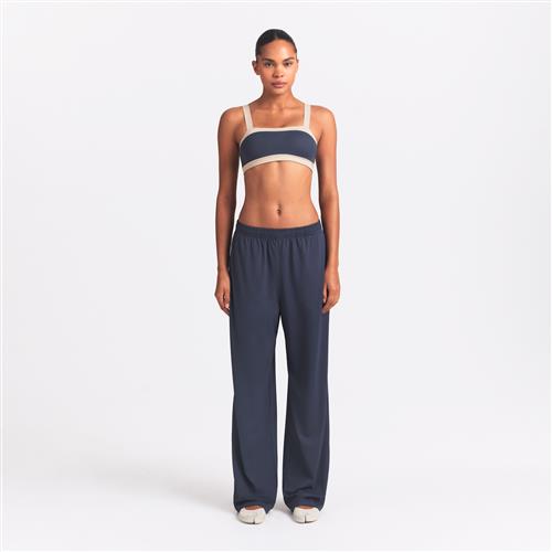 NikeSKIMS Airy-bukser med brede ben til kvinder - blå