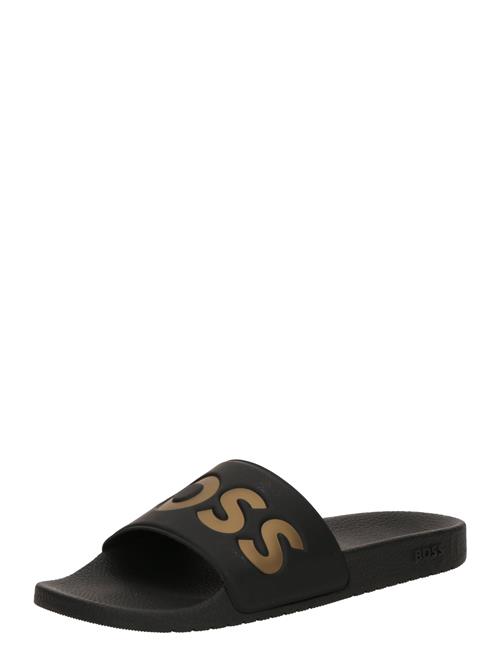 BOSS Pantoletter 'Aryeh'  guld / sort
