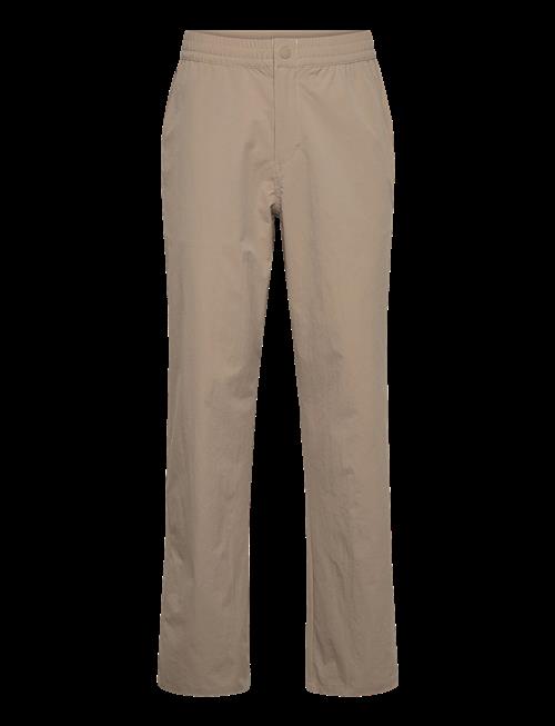 FILA | High Tide Relaxed 4-Way Stretch Trousers | L